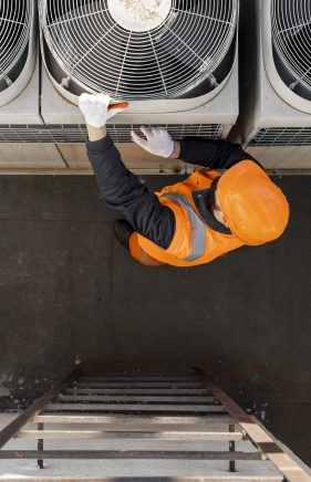 full-shot-man-working-with-equipment